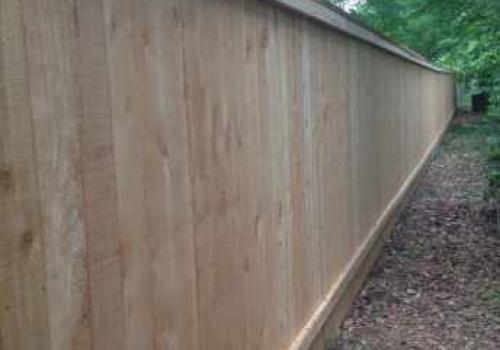 residential fencing running along perimeter of property, 
