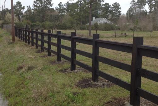 black wood fencing posts