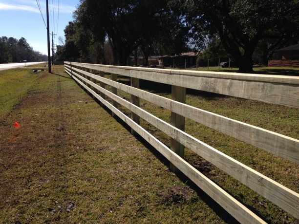 Four rail ranch style fence along a road frontage