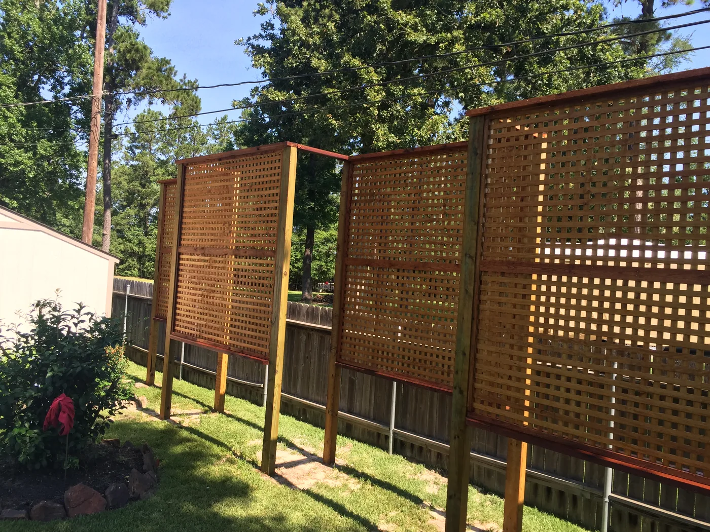 Lattice privacy screens standing on posts