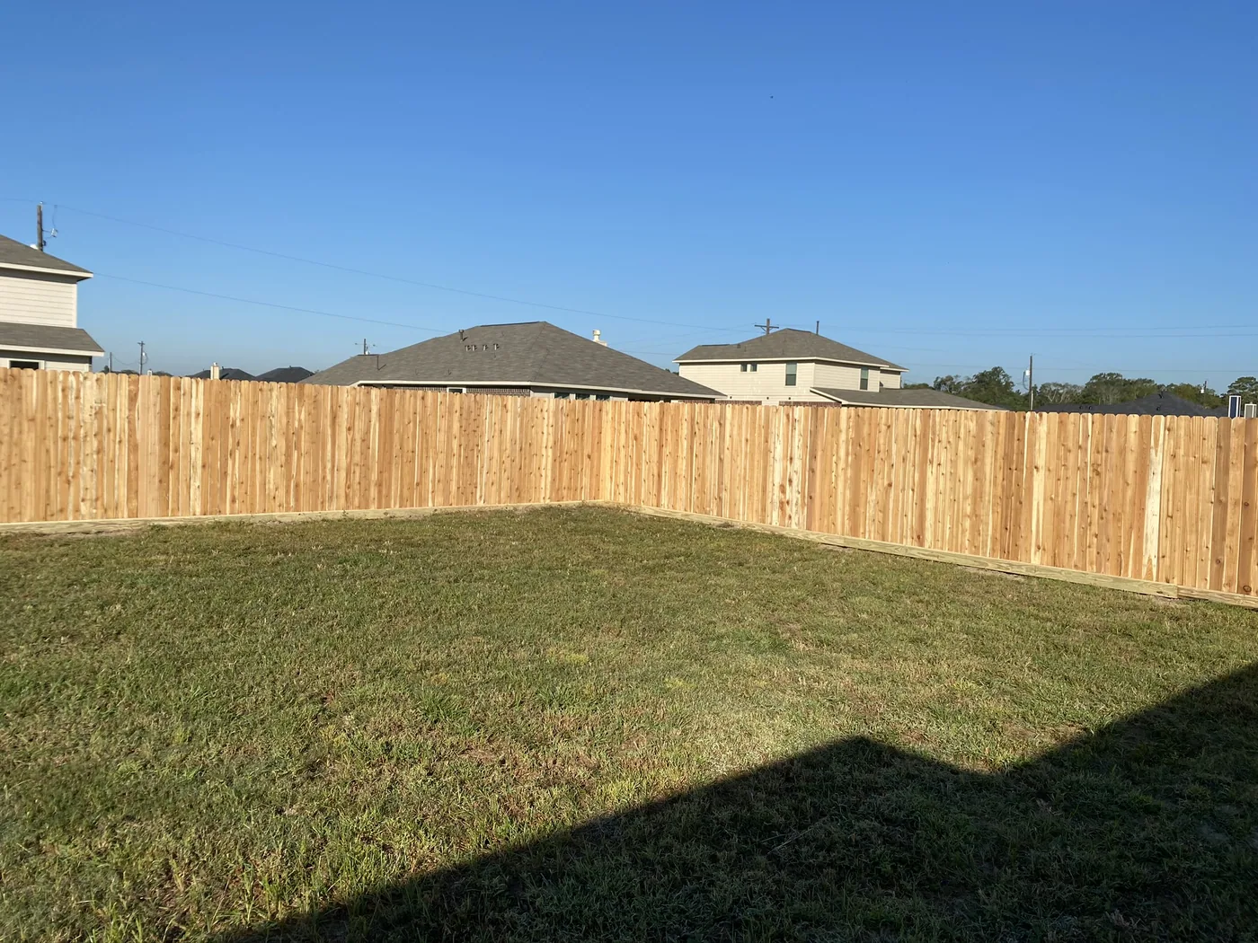 Wood privacy fence at the rear of a new-build lot