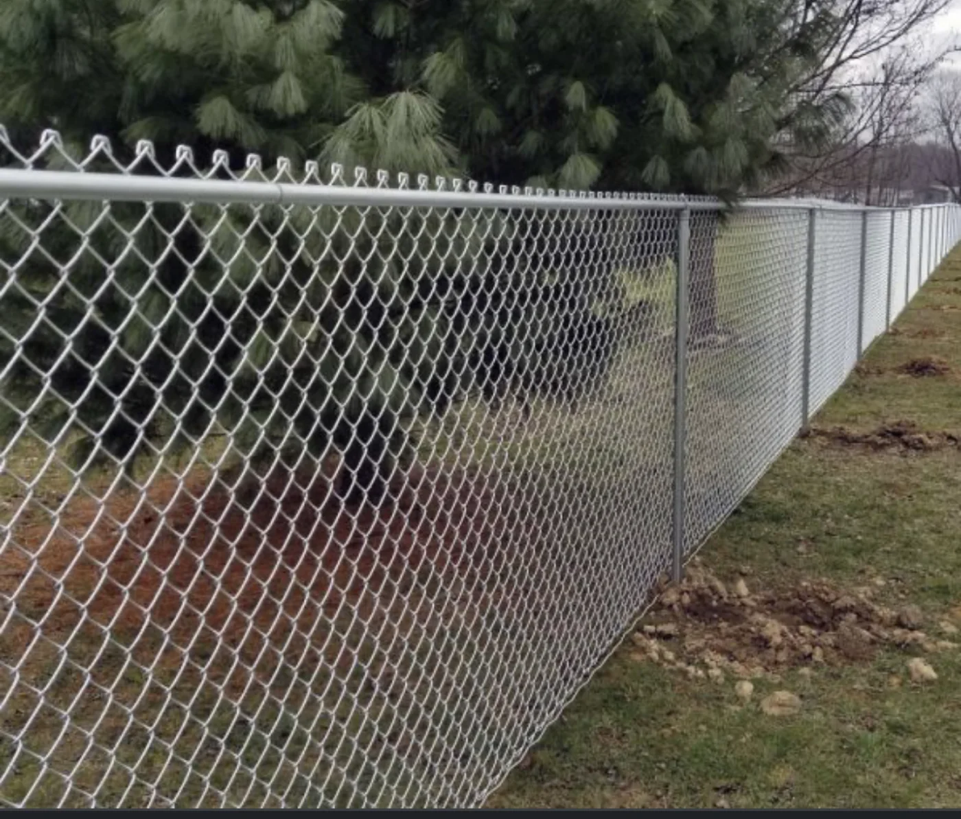 Galvanized chain link fence with a top rail