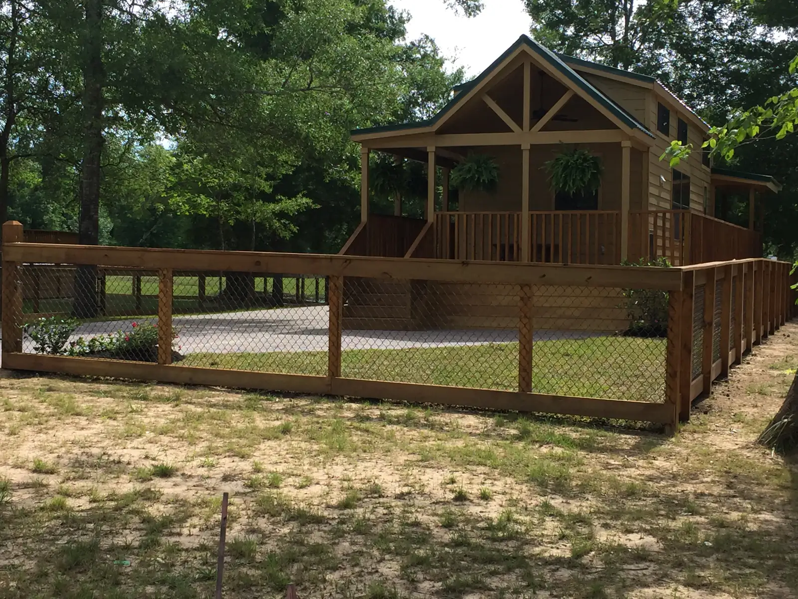 Wood deck and covered porch wrapping a cabin
