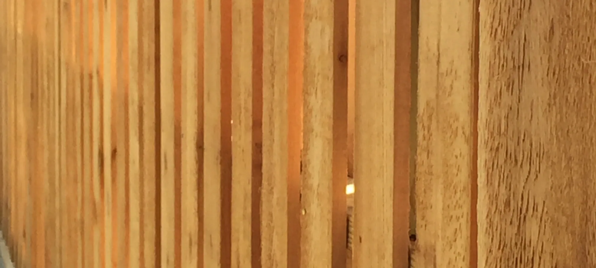 Close view of wood fence picket faces