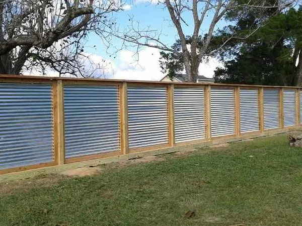 Corrugated metal panels set in a wood fence frame